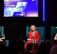 Steph McGovern and Adele Parks sitting and answering questions on stage