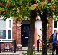 Students crossing the street outside King Edwards Square at Teesside University 