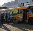 Students exploring the Yellow Bus during a Teesside University open day event