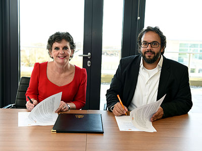 Pro Vice-Chancellor (Enterprise and Business Engagement) Professor Jane Turner OBE DL signing the memorandum of understanding with Mark South, Chief Operating Officer at Double Eleven.