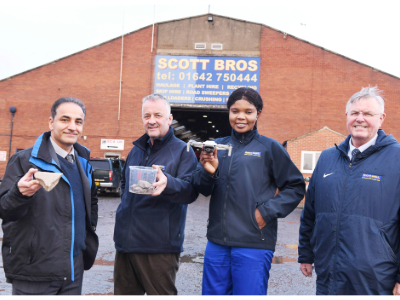 L-R) Dr Sina Rezaei Gomari, Associate Professor of Research; Peter Scott, Director, Scott Bros; Eghe Ikponmwosa-Eweka, KTP Associate; Bob Borthwick, Director, Scott Bros. Pictured holding clay to be used in the artificial soil as well as a drone that will be used in the monitoring of the test site.