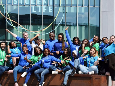An image of a group of Student Engagement Assistants outside of the Student Life building. Link to We are recruiting! Student Engagement Assistants.