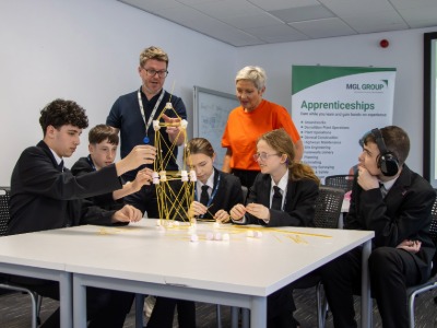 Michelle Henderson (NESF) watches students build a tower. Link to Michelle Henderson (NESF) watches students build a tower.