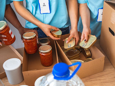 An image of volunteers packing items at a food bank. Link to Do Good, Feel Good: The Junction Multibank, 14 October.