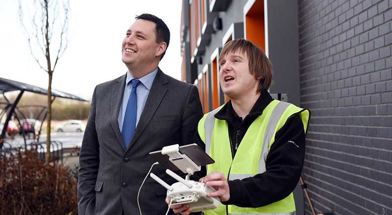 Ben Houchen (left) is shown how to fly the drone by Chris Young of Rectrix