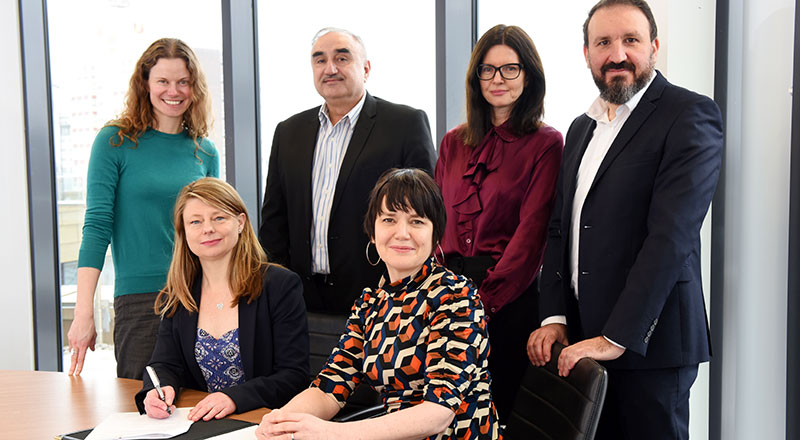 Siobhan Fenton and Kim Gauld-Clark signing the Memorandum of Understanding with staff from Teesside University and Sofia.