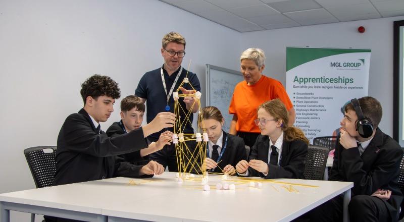 Michelle Henderson (NESF) watches students build a tower. Link to Michelle Henderson (NESF) watches students build a tower.