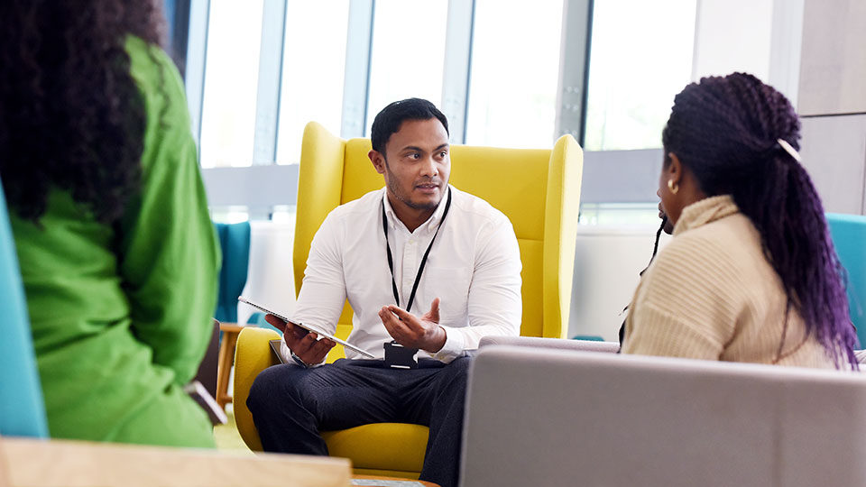 Support from Student Futures staff at Teesside University Student Futures staff members talking at Teesside University