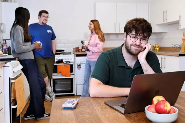 Students in a kitchen talking in University accommodation