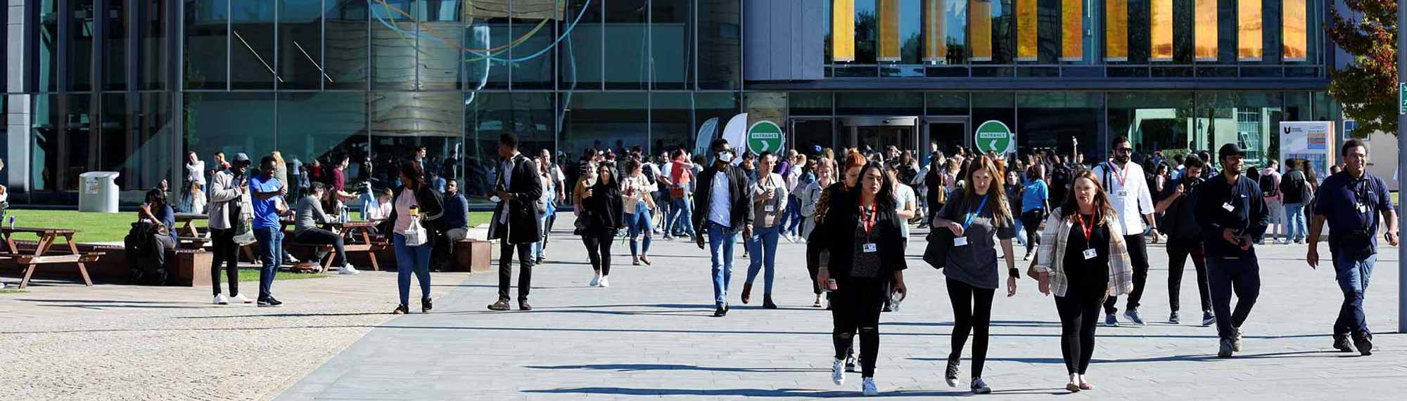 Students walking around campus in a University open day