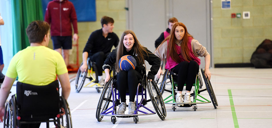 Students playing wheelchair basketball at Olympia sports hall