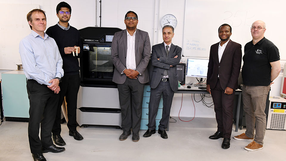 Staff, KTP students and collaborative companie memmbers in a Teesside university lab
