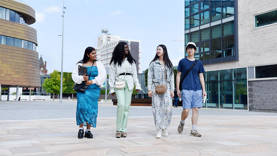 Teesside University International students walking in campus