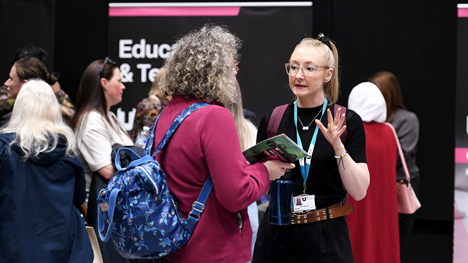 Parents talking with staff in a open day