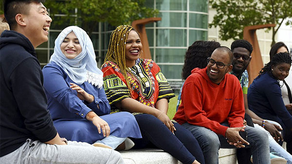 International students sitting and talking in the Campus Centre at Teesside University