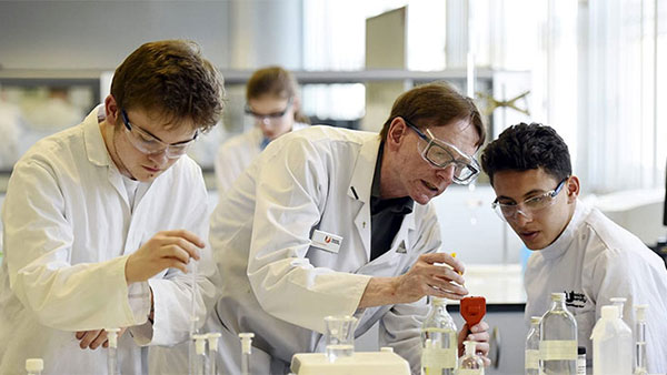 International undergraduate students and staff collaborating in a laboratory at Teesside University