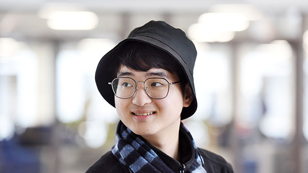 International student in a coffee shop preparing for a credibility interview