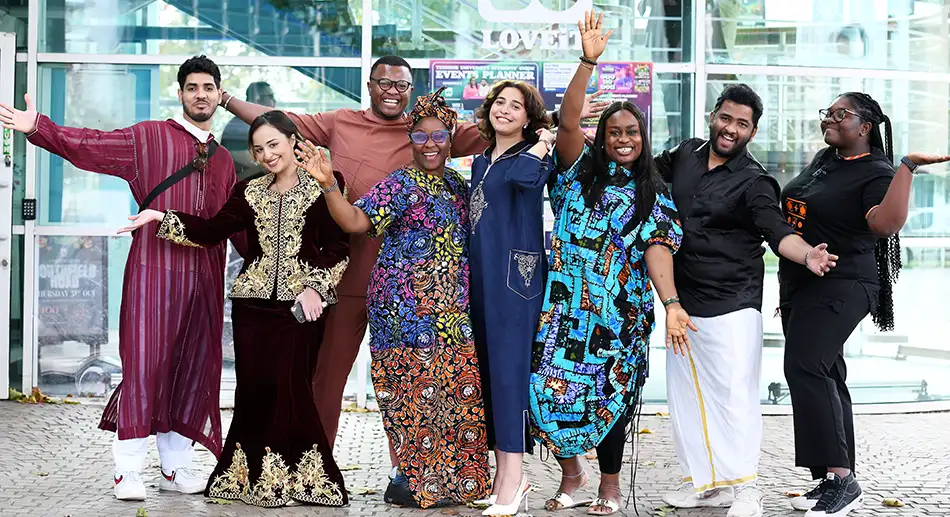International students in traditional dress in the cultural festival at Teesside University