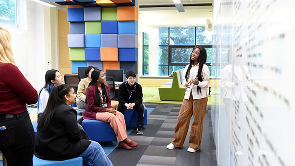 Postgraduate students studying together in a classroom