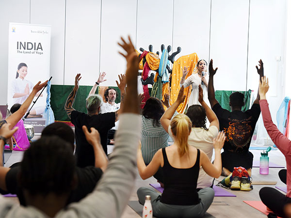 Student and staff doing yoga in the International Day of Yoga