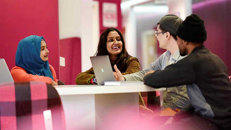 Students chatting around a table