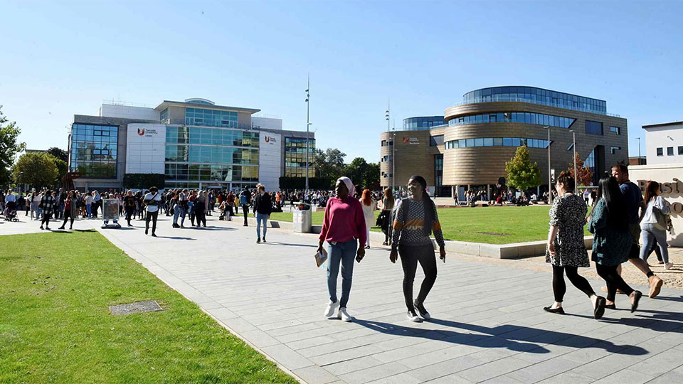 Students walking in the Campus Heart at Teesside University