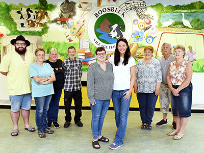 Karen O'Rourke, Boosbeck Village Hall trustee, with Be The Change nominator, Lindsey Mays, and group members