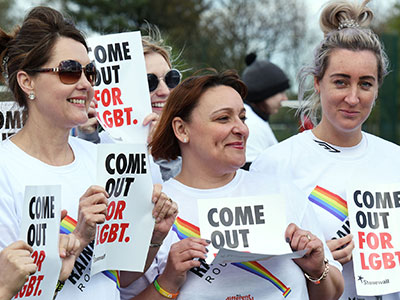 Teesside University staff with proud flags