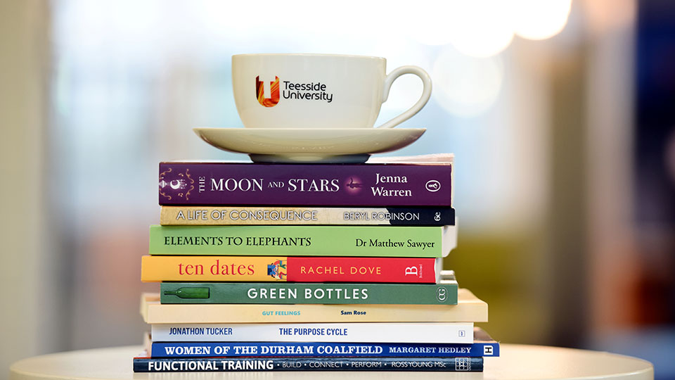 Some Alumni boks with a cup of Teesside university of coffee at the top