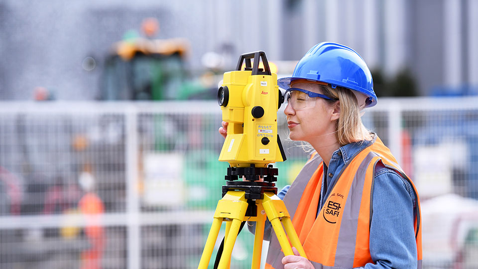 Student with a helmet in a construction site