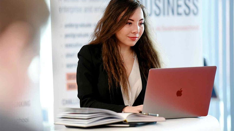 Student using a laptop. Link to Short courses & CPD.