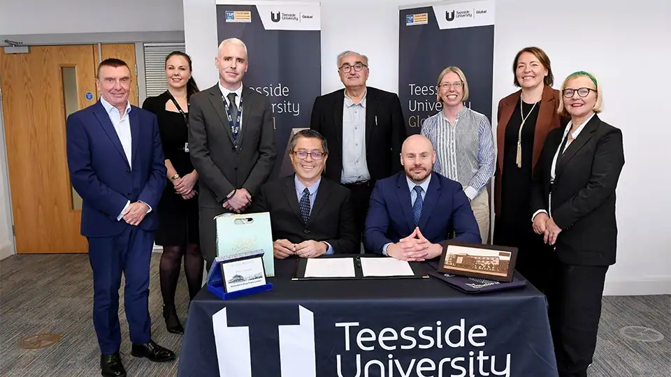 Teesside University staff with staff from an international partner