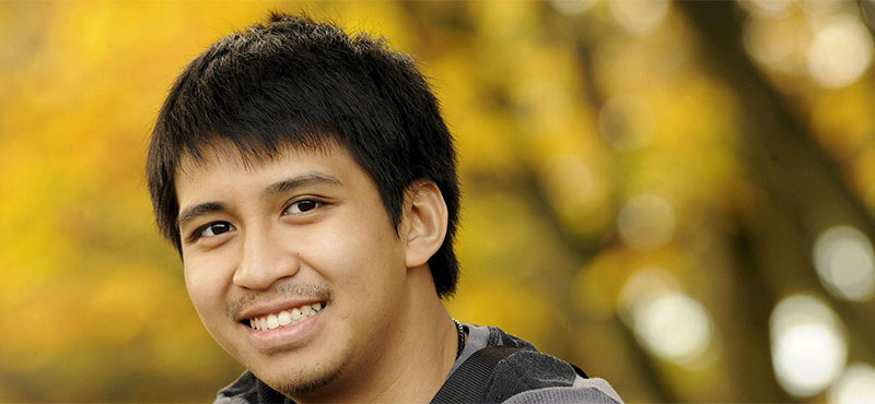 International student enjoying a peaceful moment in a UK park