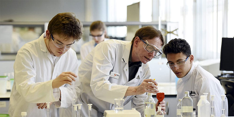 International undergraduate students and staff collaborating in a laboratory at Teesside University