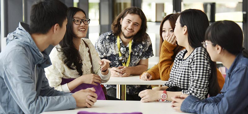 International students in the library – UK Higher Education Immersion Programme at Teesside University International students sitting and working together in the library at Teesside University
