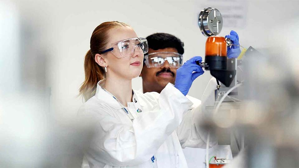 Female staff member working in the Net Zero research lab at Teesside University. Link to Explore Teesside University's Net Zero research initiatives.