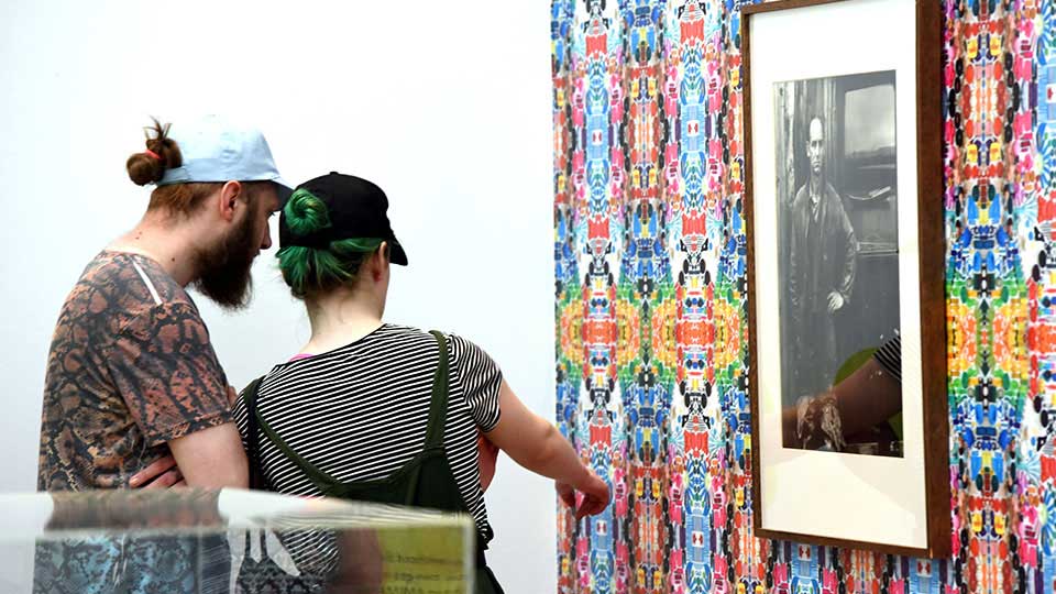 Students exploring an art gallery, reflecting research impact and community engagement at Teesside University