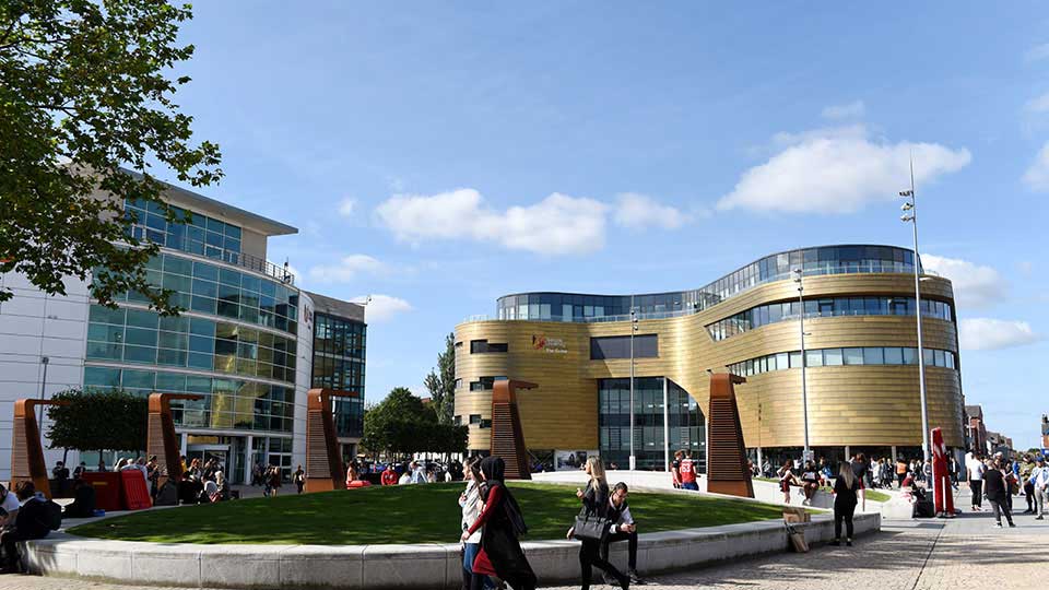 Students walking through Campus Heart at Teesside University