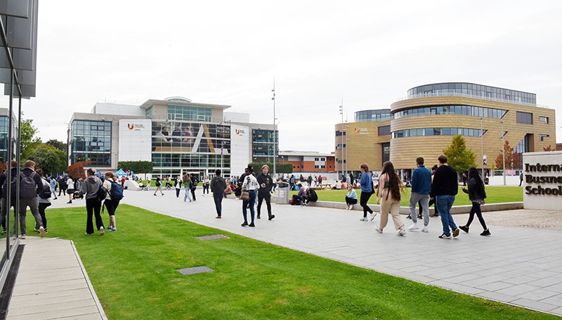Students walking across the Teesside University campus