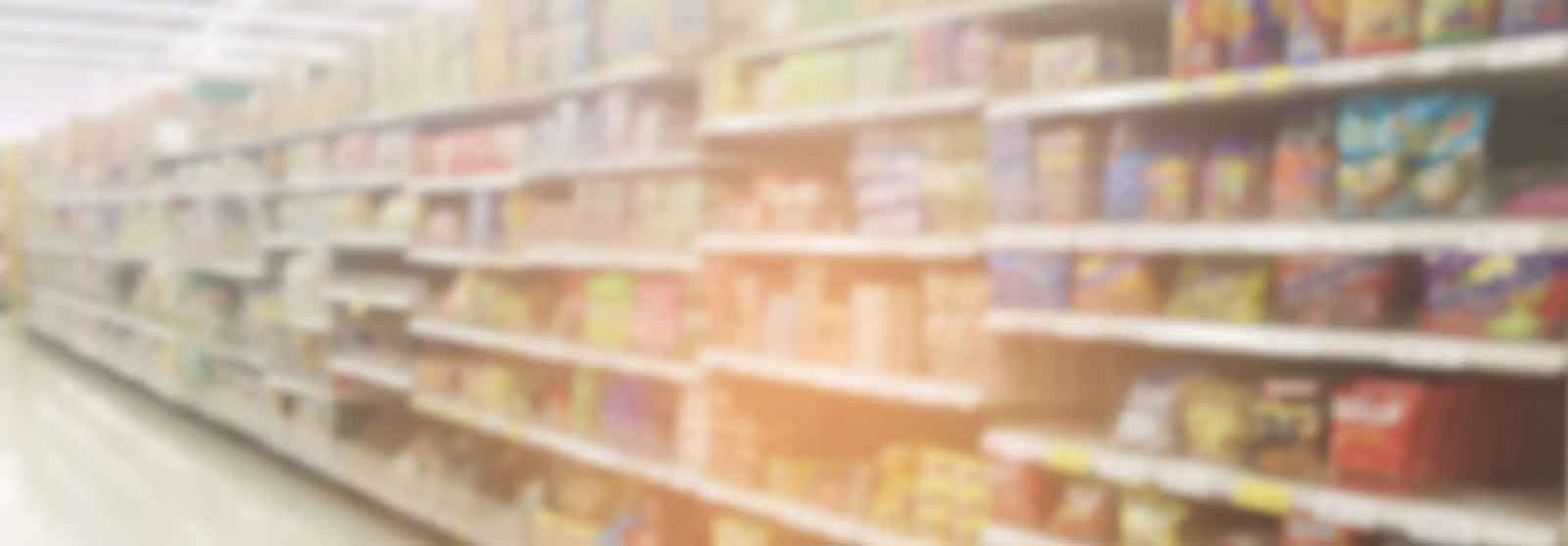 Supermarket shelves stocked with various products and goods