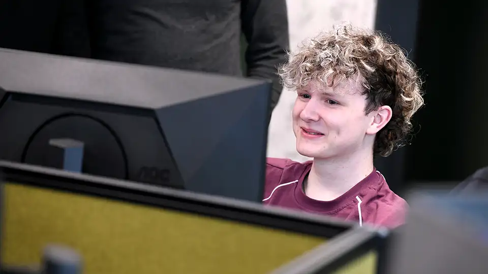 Student in a lab in front of the computer