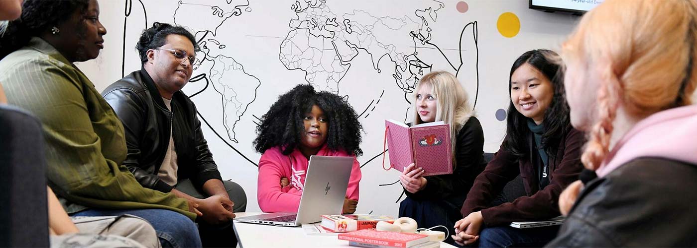 Student support advisor speaking with a student in the Student Life Building, Teesside University