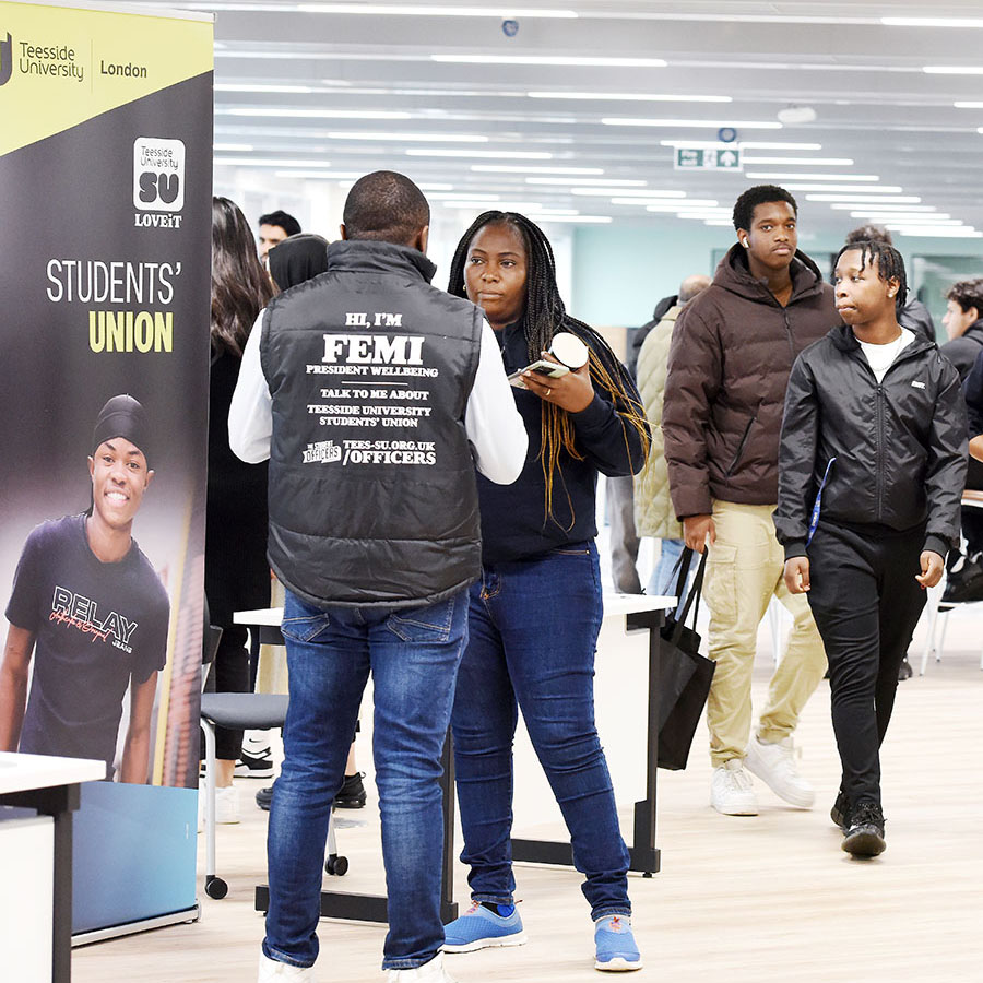 Students and ambassadors at a stand during an Open Day at Teesside University London