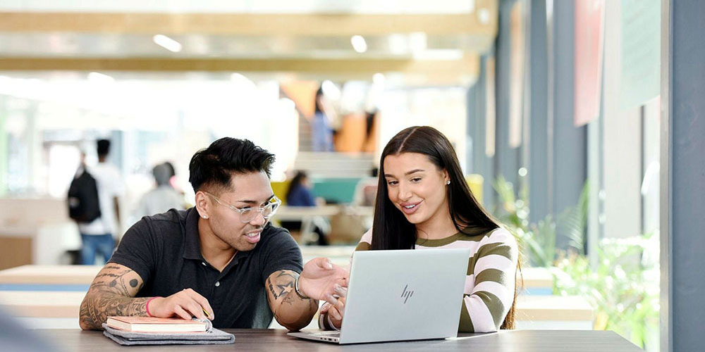 TU Prague City Study Centre students studying together with a tablet